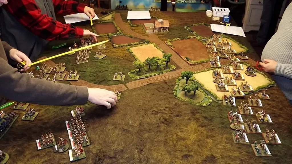 A photo of people playing a wargame.