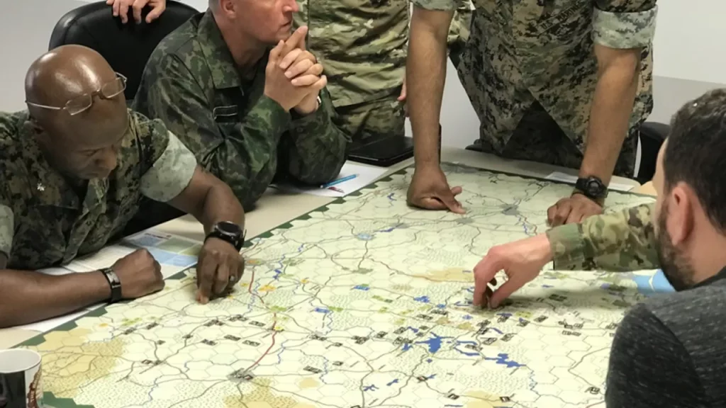A photograph of military soldiers wargaming.