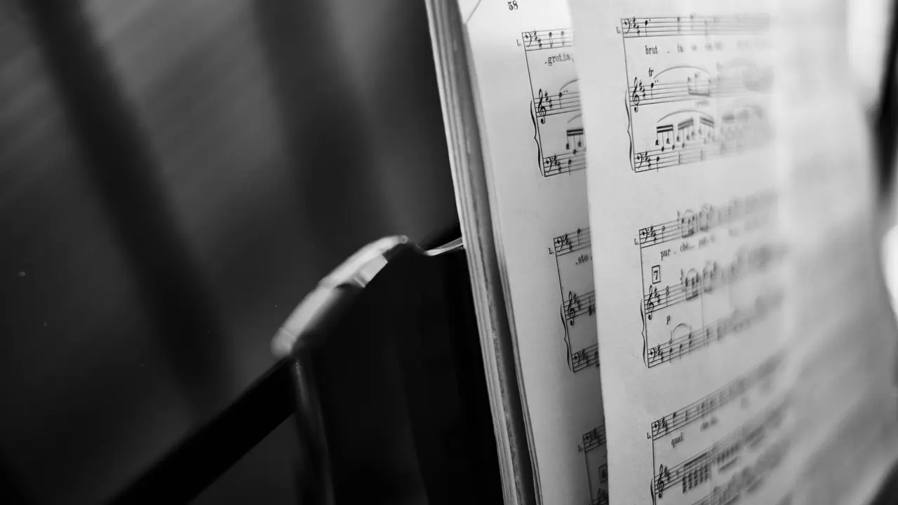 A black and white photo of a music score. Illustrates [alt text].