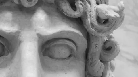 A close up photo of a marble statue. Illustrates [alt text].