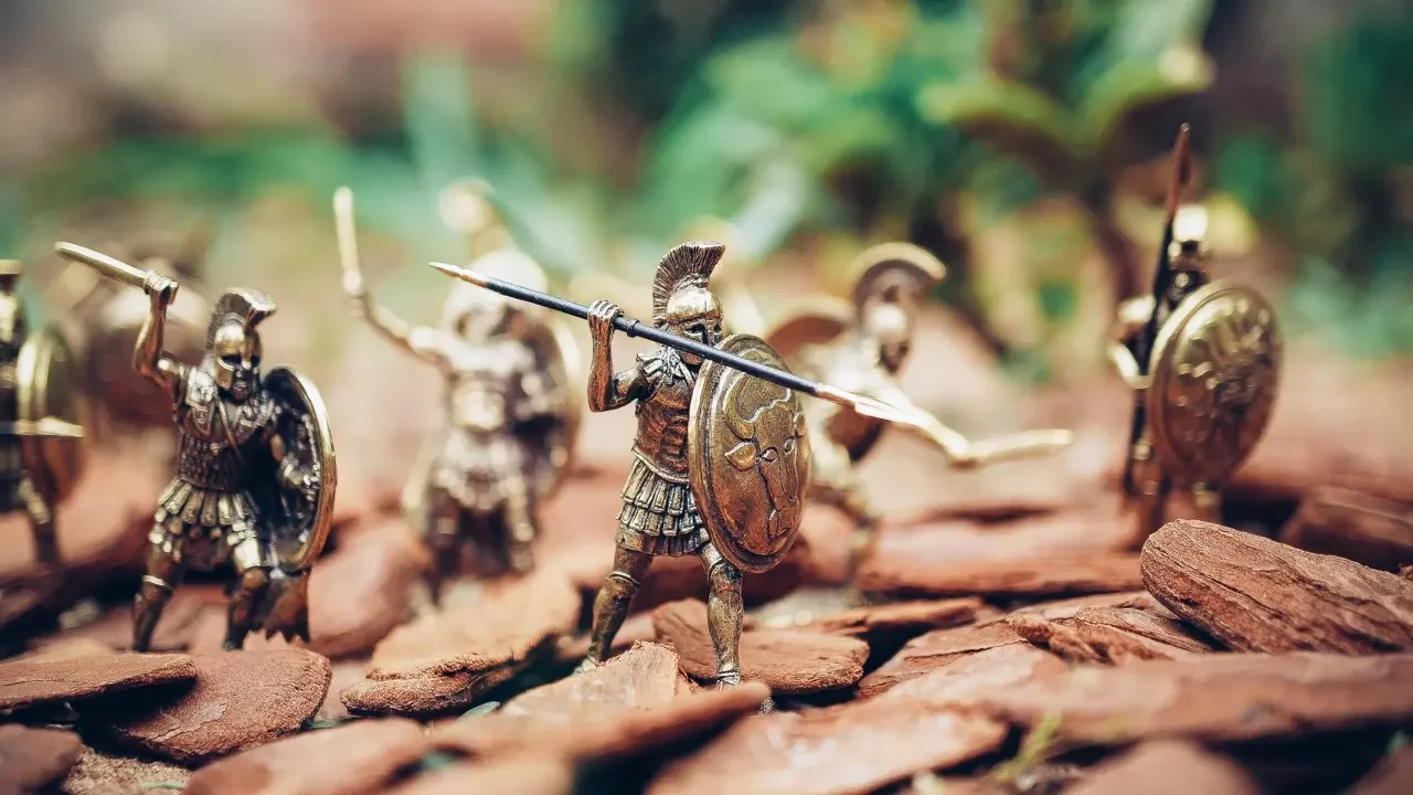 Grey metal knights figurines during daytime.