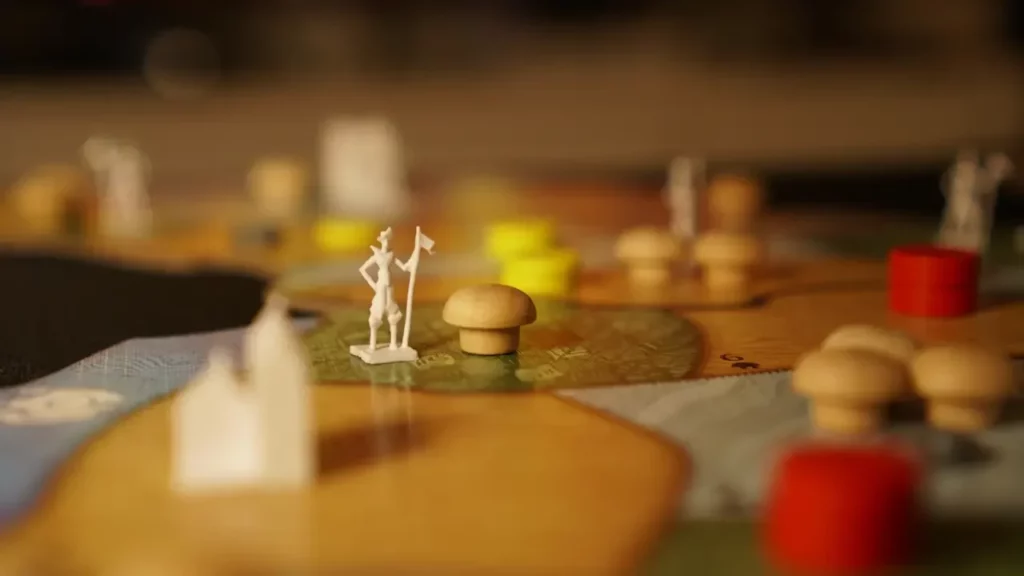 a-close-up-of-a-board-game-with-figurines-on-it A close up of a board game with figurines on it. Themes of the link between social anxiety and TTRPG.