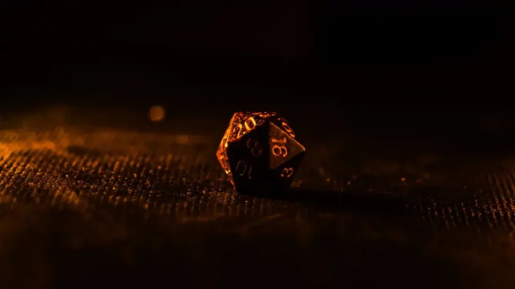 Dramatic photograph of a d20 die. Themes of 2024 Player's Handbook.