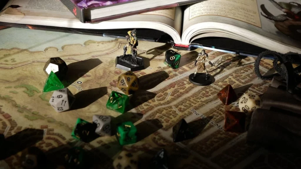 Models and dice on a map and rulebook.