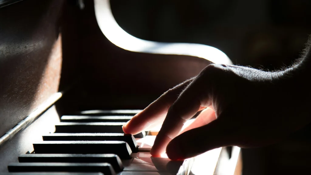 Person playing piano. Themes of audio and music.