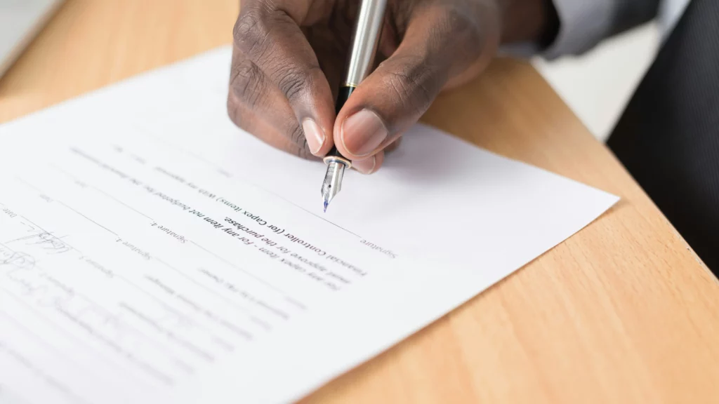 Person writing a document. Themes of items being reused.