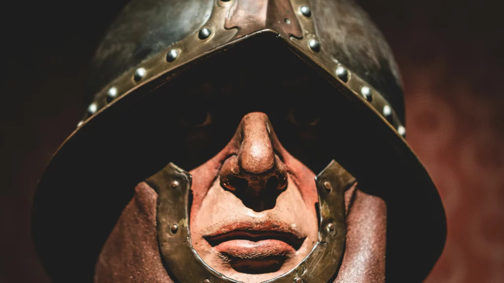 Brown and gray helmet and mask. Themes of NPC creation.