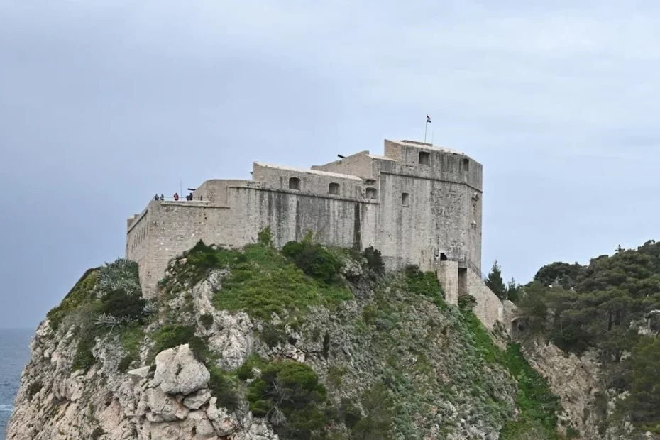 A photo of an old fort on a cliff overlooking the sea.