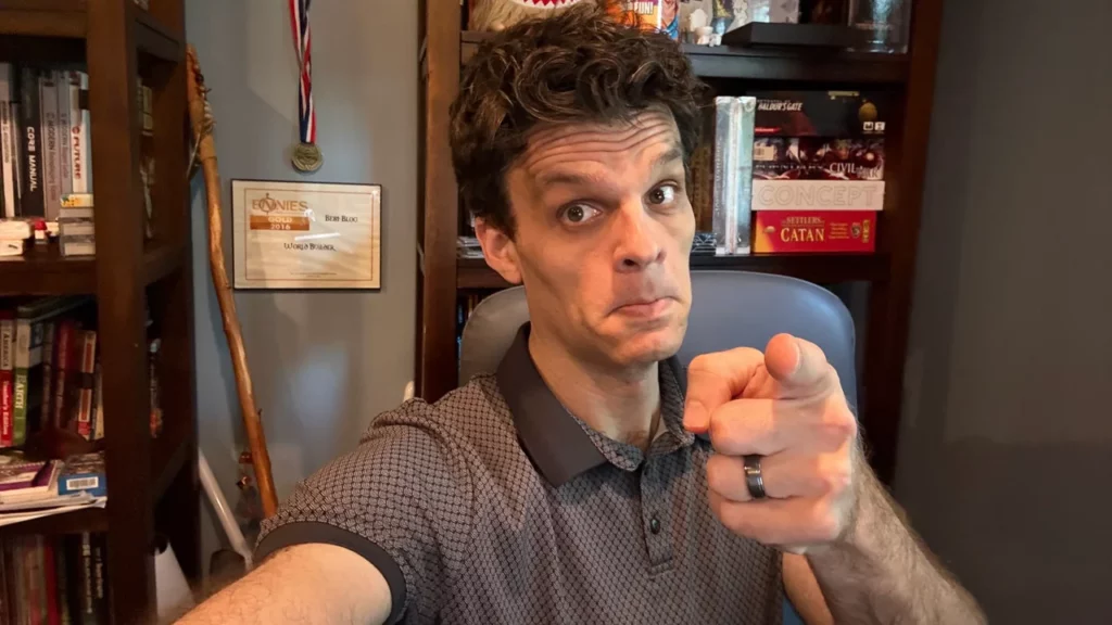 A photo of James Introcaso pointing at the camera.