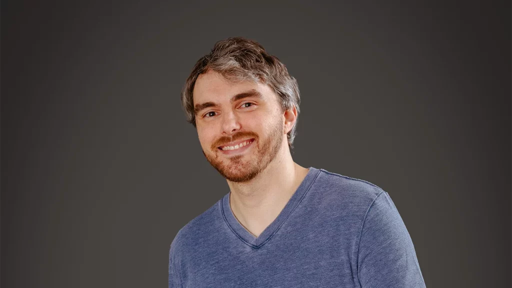 A headshot photo of Andrew Clayton (Atropos)